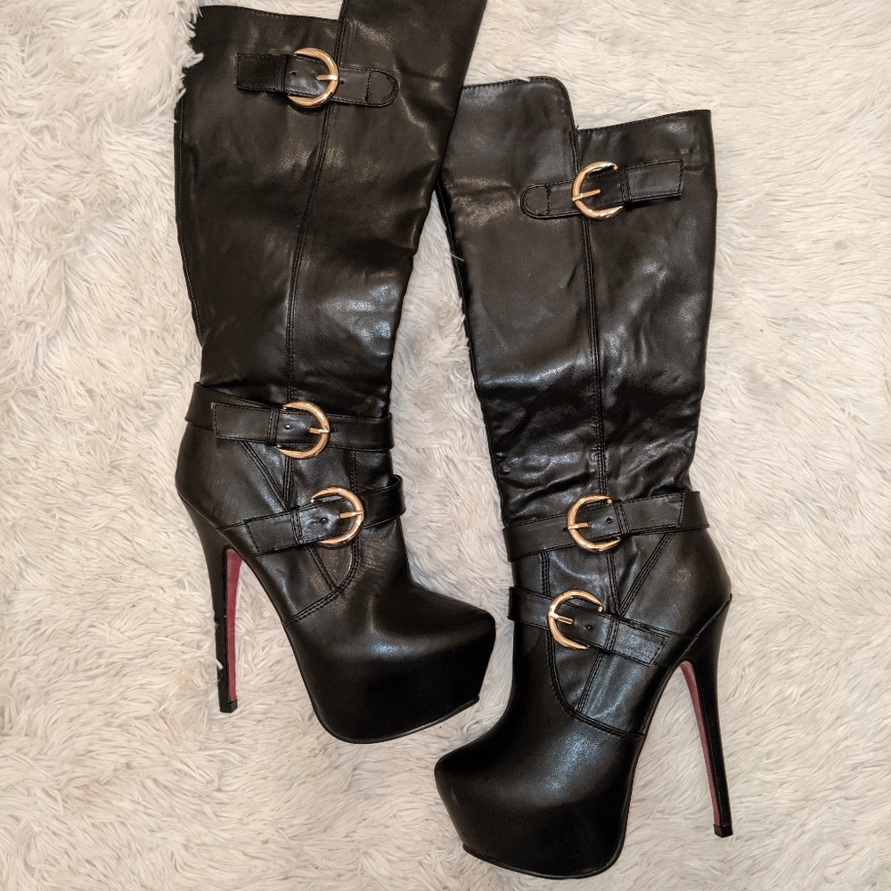 Black heeled boots with side buckles